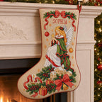 Angel Christmas cross stitch stocking mockup hanging from a fireplace mantel