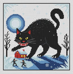 Yule Cat cross stitch design on white fabric: a giant black cat, blue full moon, red snow-covered cottage, bare trees and two tiny figures, framed by a thin black border.
