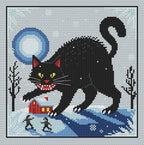 Jólakötturinn cross stitch design on pale blue fabric, showing a black cat with an arched back and curled tail above a snowy red cottage beneath the full moon.